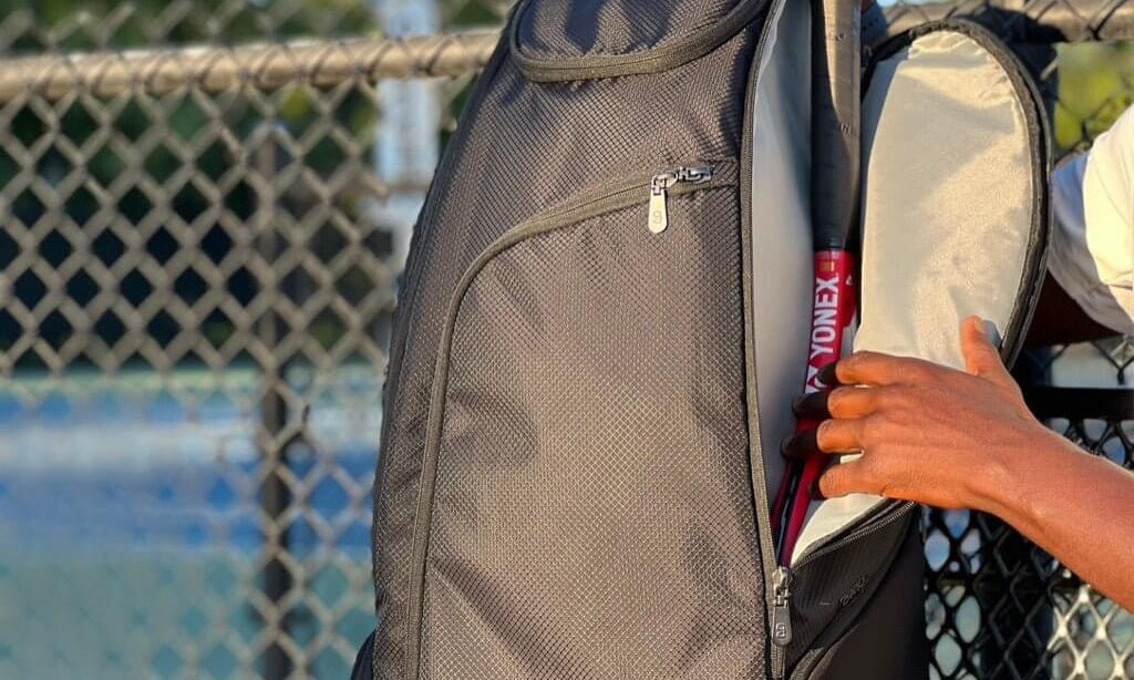 Black tennis bag for players with padded straps and large storage