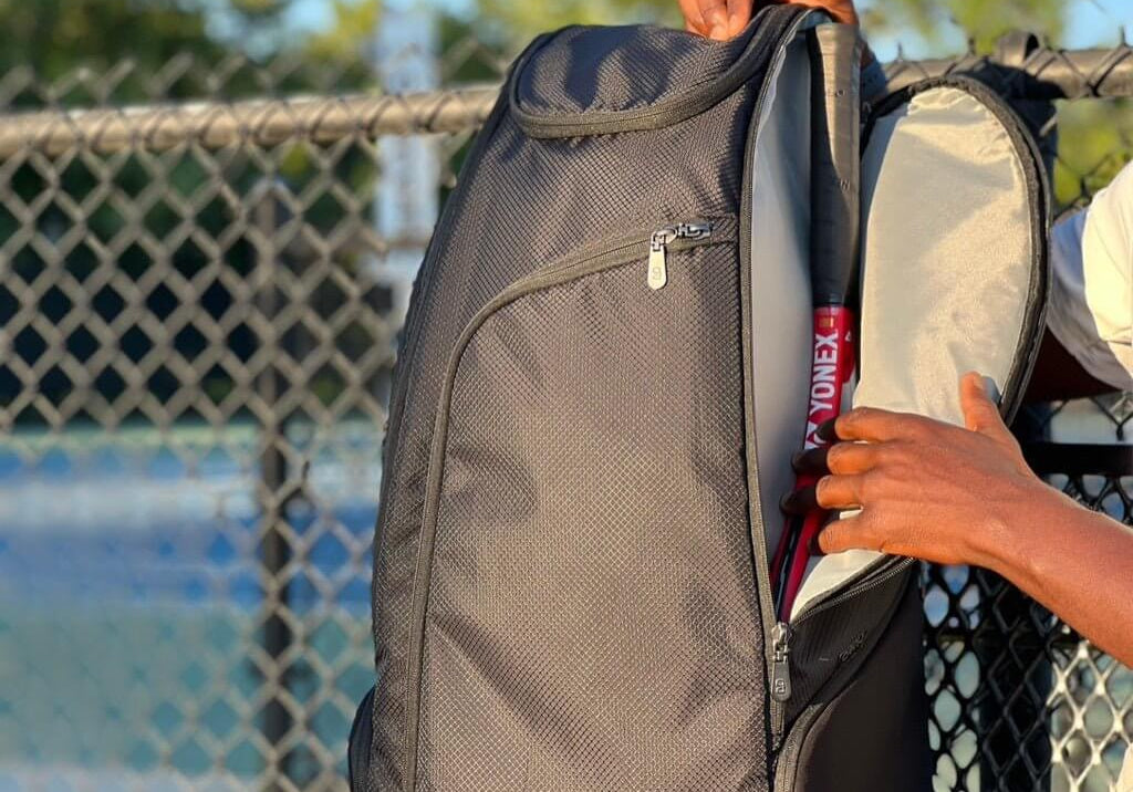 Black tennis bag for players with padded straps and large storage