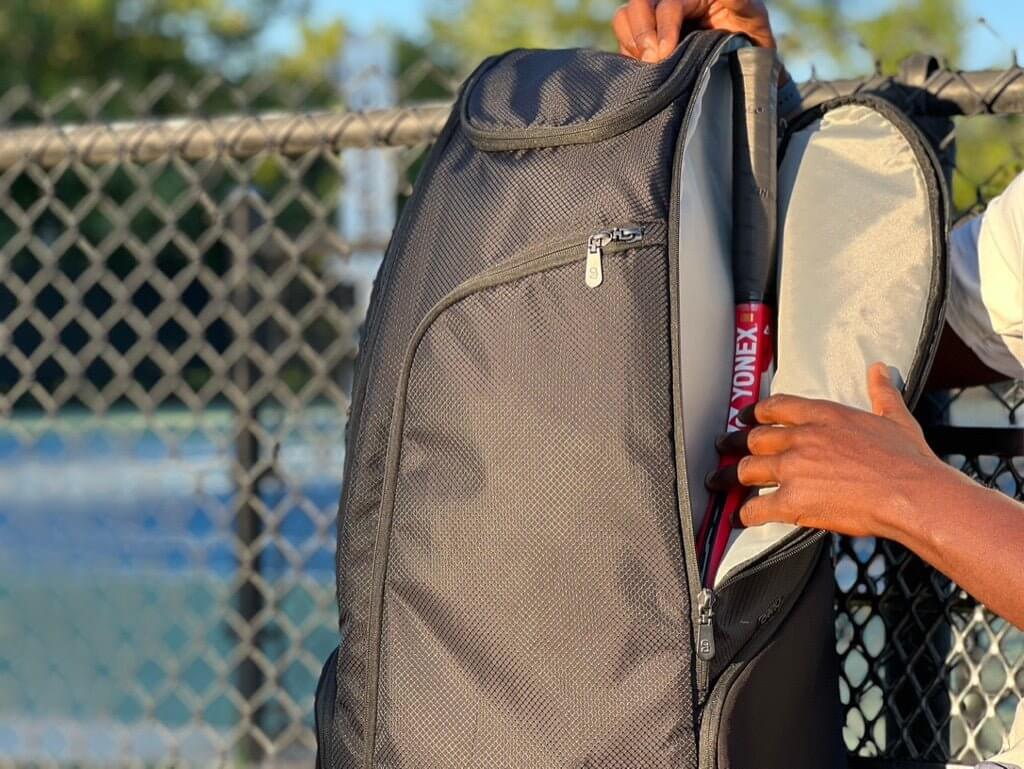Black tennis bag for players with padded straps and large storage